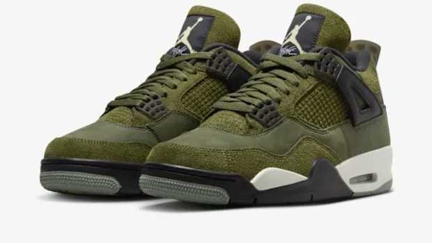 Side view of green and black Air Jordan sneakers.